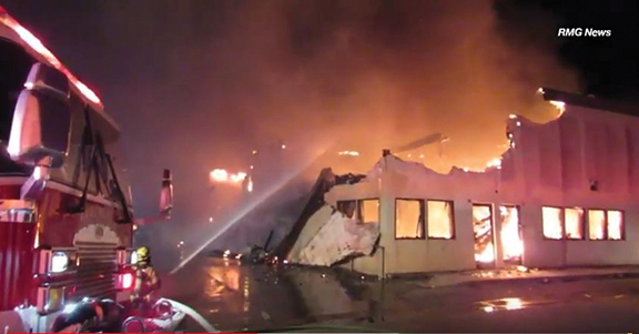 Big fire destroys auto body shopng - Cover Image